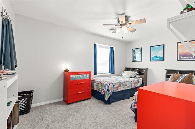 bedroom with ceiling fan and light colored carpet