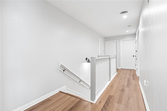 hall with light hardwood / wood-style floors