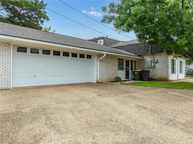 ranch-style home featuring a garage