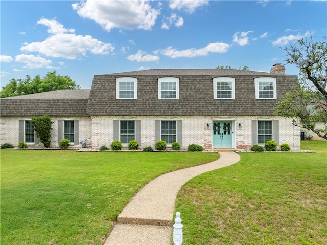 view of front of house with a front lawn