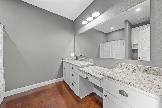 bathroom with vanity, walk in shower, and concrete floors