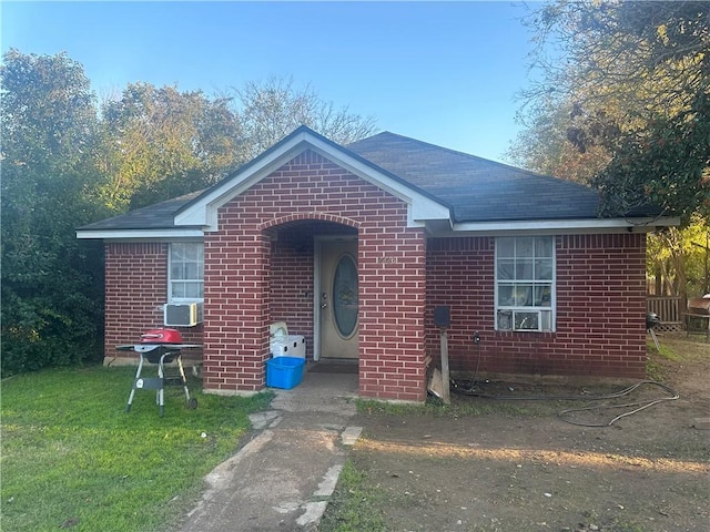 bungalow-style house with a front yard