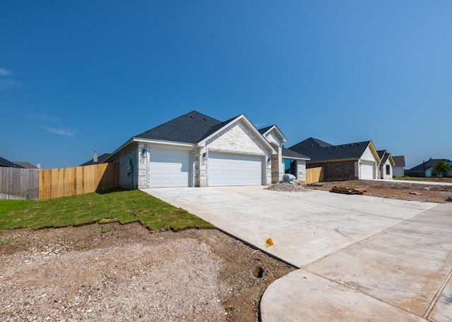 ranch-style home featuring a garage