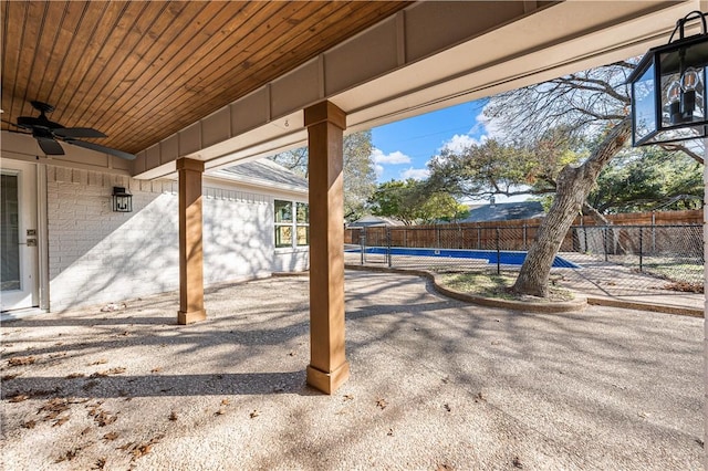 view of patio / terrace with an empty pool and ceiling fan