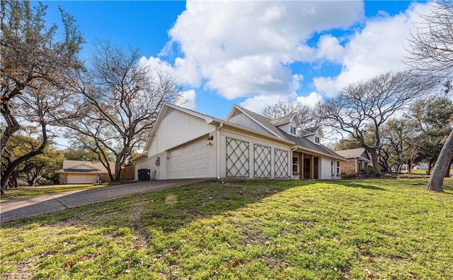 view of home's exterior with a garage and a lawn