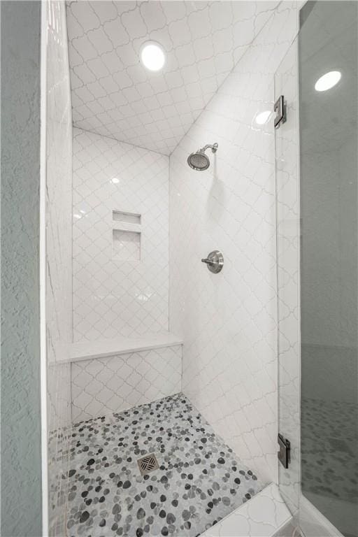 bathroom with tiled shower