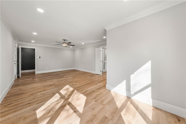 unfurnished room with ceiling fan, ornamental molding, and light hardwood / wood-style flooring