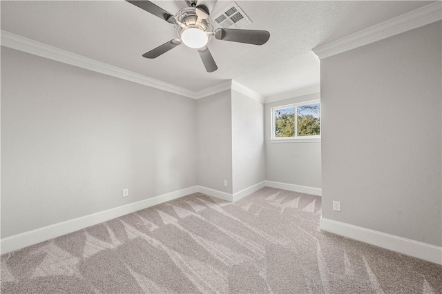 carpeted spare room with crown molding and ceiling fan