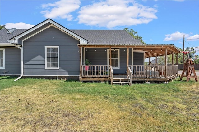 rear view of house with a lawn