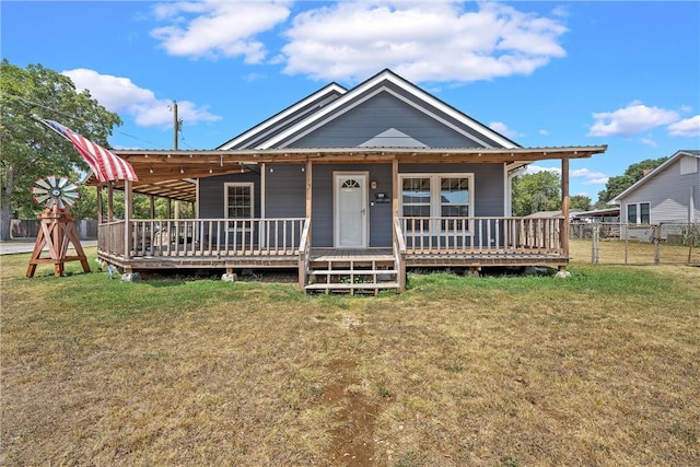 view of front of property featuring a porch and a front yard