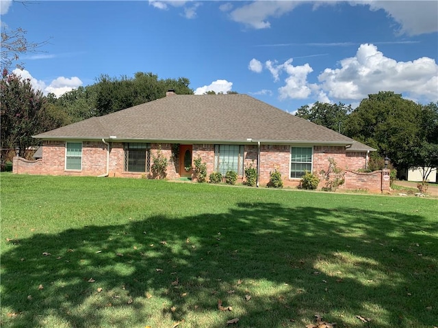 ranch-style house with a front yard