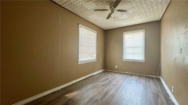 unfurnished room featuring ceiling fan and wood-type flooring