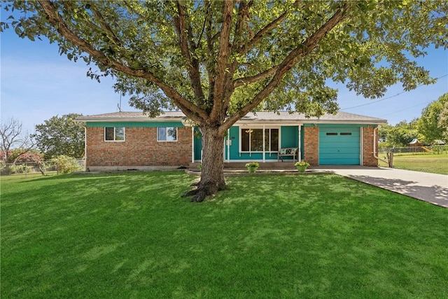 ranch-style home with a front yard and a garage