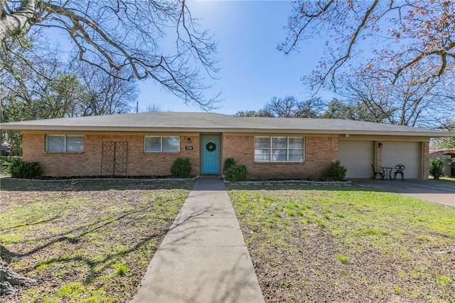 view of front of property featuring an attached garage, brick siding, driveway, and a front yard