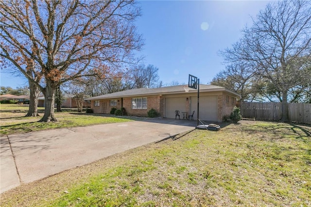 ranch-style house with a garage, concrete driveway, fence, a front yard, and brick siding