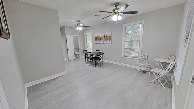 dining room with ceiling fan and light hardwood / wood-style floors