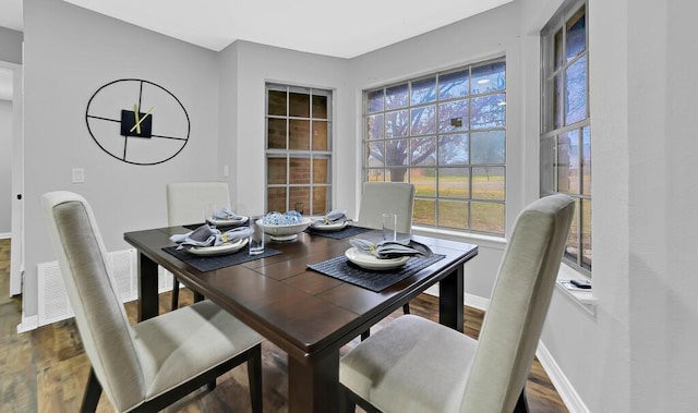 dining area with hardwood / wood-style floors