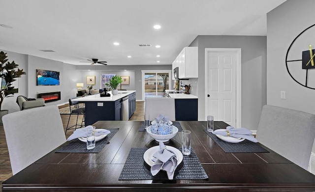 dining room featuring dark hardwood / wood-style floors and ceiling fan