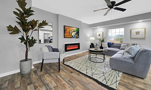 living room featuring hardwood / wood-style flooring and ceiling fan