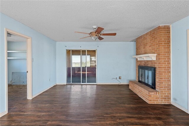 unfurnished living room with a textured ceiling, dark hardwood / wood-style floors, and ceiling fan