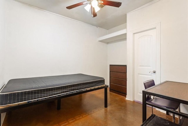 bedroom featuring ceiling fan and concrete floors