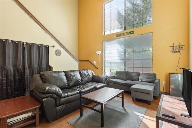 living room with a towering ceiling