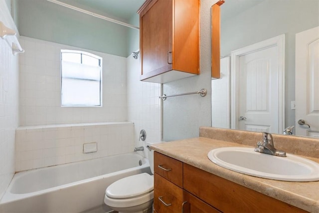 full bathroom featuring vanity, tub / shower combination, and toilet