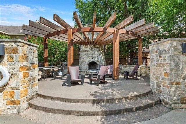 view of patio / terrace featuring an outdoor stone fireplace and a pergola