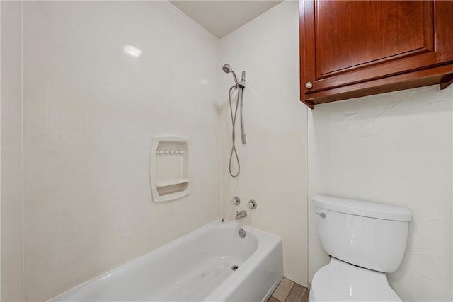 bathroom with bathing tub / shower combination and toilet