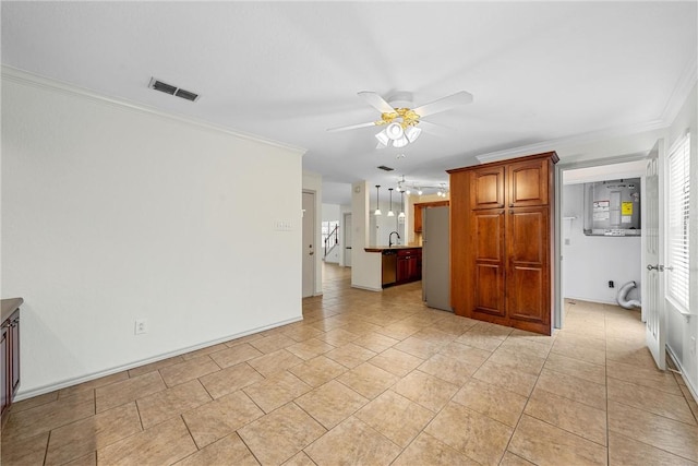 tiled empty room featuring ceiling fan, ornamental molding, and sink