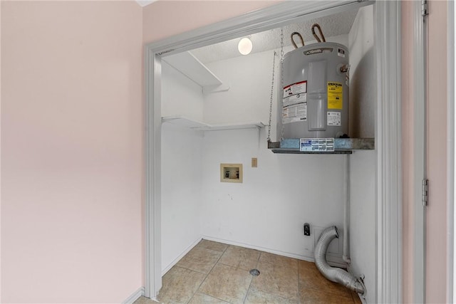 laundry room with water heater and hookup for a washing machine