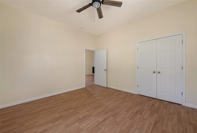 unfurnished bedroom featuring a closet, ceiling fan, and light hardwood / wood-style flooring