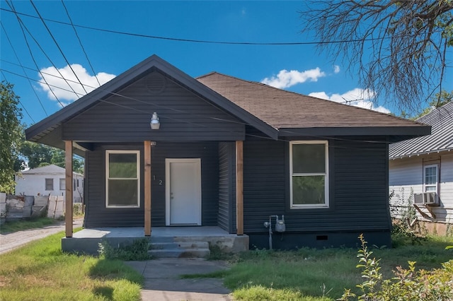 bungalow featuring cooling unit and covered porch