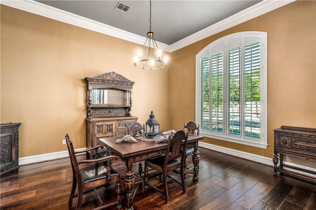 dining room with a notable chandelier, dark hardwood / wood-style floors, a healthy amount of sunlight, and ornamental molding