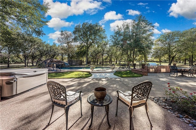 view of patio / terrace featuring a hot tub