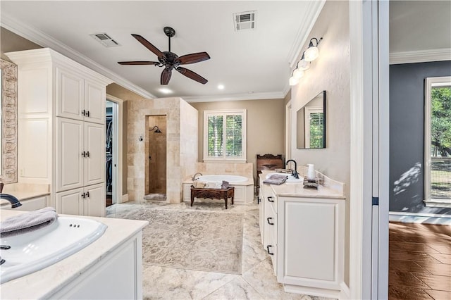 bathroom featuring plus walk in shower, plenty of natural light, vanity, and ceiling fan