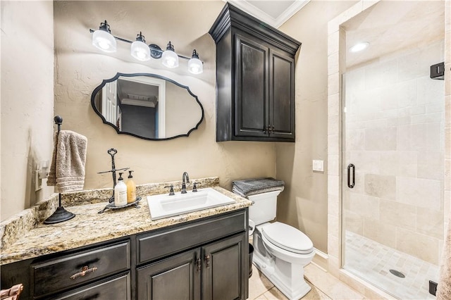 bathroom with tile patterned floors, vanity, a shower with door, crown molding, and toilet