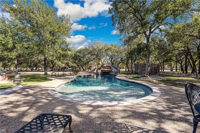 view of swimming pool featuring a water slide