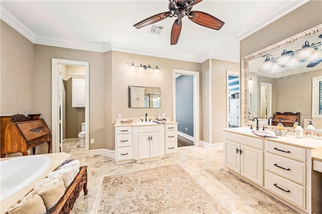 bathroom featuring ceiling fan, crown molding, vanity, and toilet