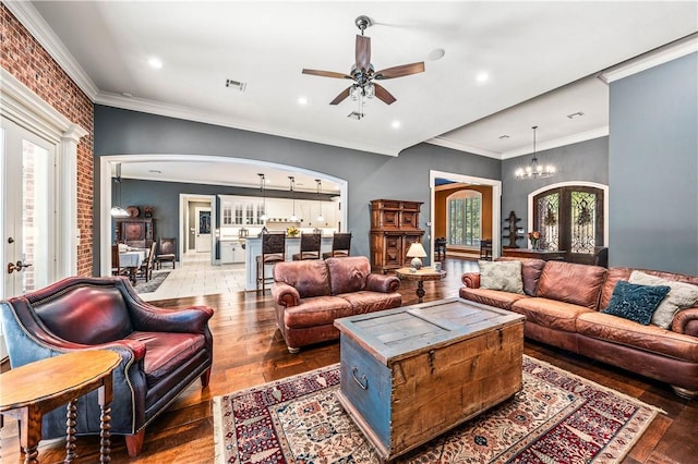 living room featuring wood-type flooring, french doors, and a healthy amount of sunlight