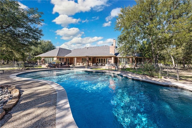 view of swimming pool featuring a patio area