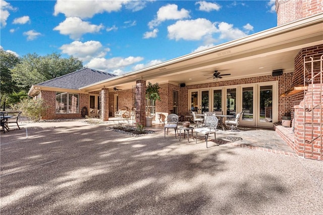 view of patio / terrace featuring ceiling fan and french doors