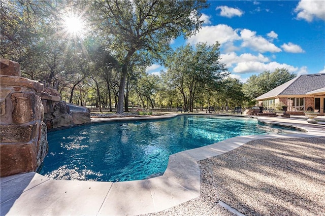 view of swimming pool with a patio