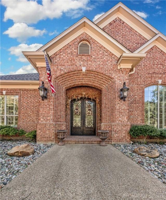 doorway to property featuring french doors