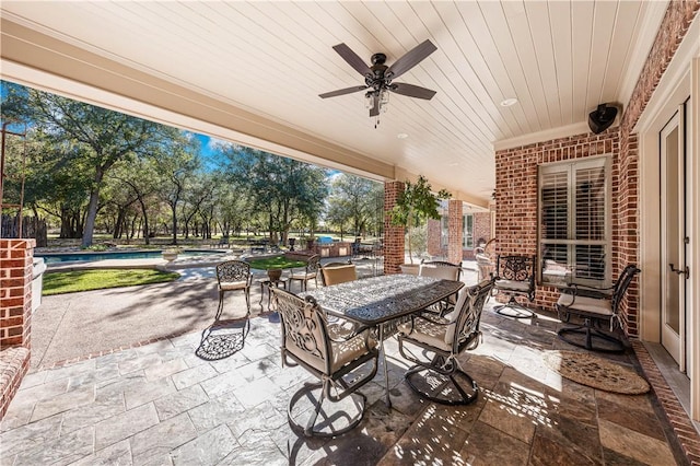 view of patio featuring ceiling fan