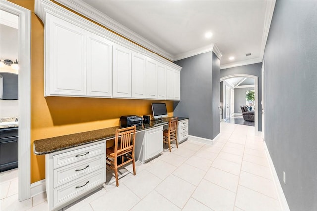 tiled office featuring built in desk and ornamental molding