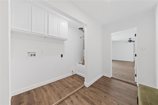 laundry area with hookup for a washing machine, ceiling fan, dark wood-type flooring, and cabinets