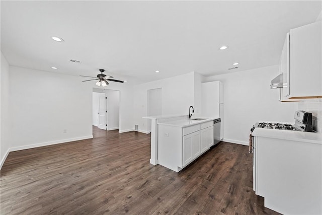 kitchen featuring kitchen peninsula, dishwasher, white cabinets, dark hardwood / wood-style floors, and range hood