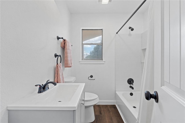 full bathroom with shower / tub combination, vanity, hardwood / wood-style flooring, and toilet