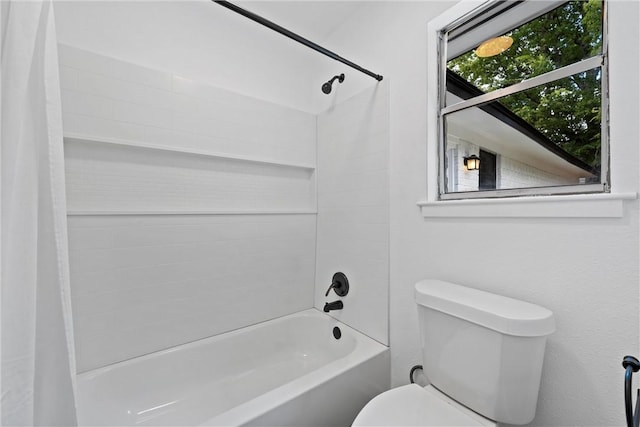 bathroom with toilet and shower / bathtub combination with curtain